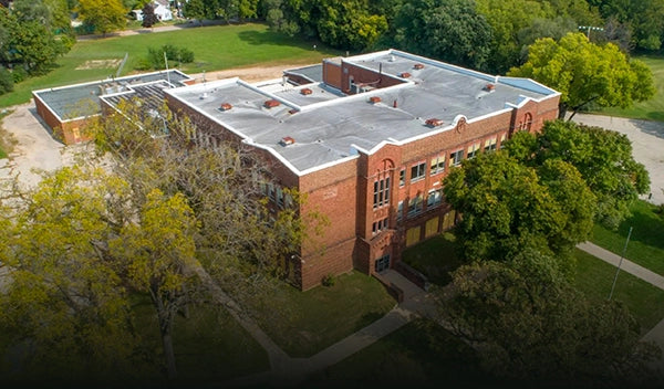 An overhead drone image of the Rising Tide Center building where you can see all of the surrounding sports fields and grounds